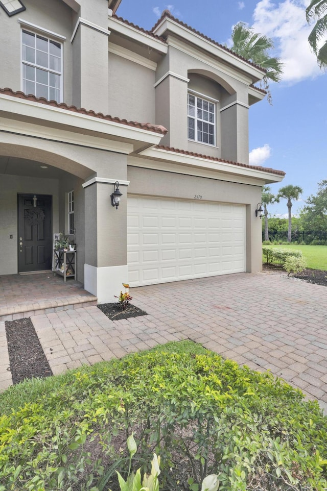 view of front of property with a garage