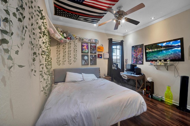 bedroom with ceiling fan, dark hardwood / wood-style flooring, and crown molding