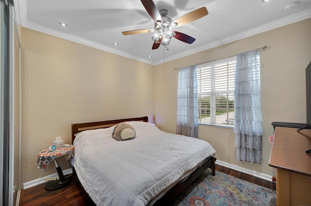 bedroom featuring ceiling fan, crown molding, and dark hardwood / wood-style floors