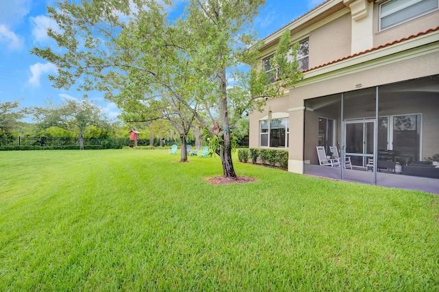 view of yard with a sunroom