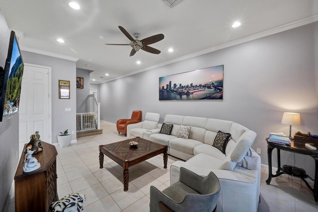 living room featuring ceiling fan, light tile patterned flooring, and ornamental molding