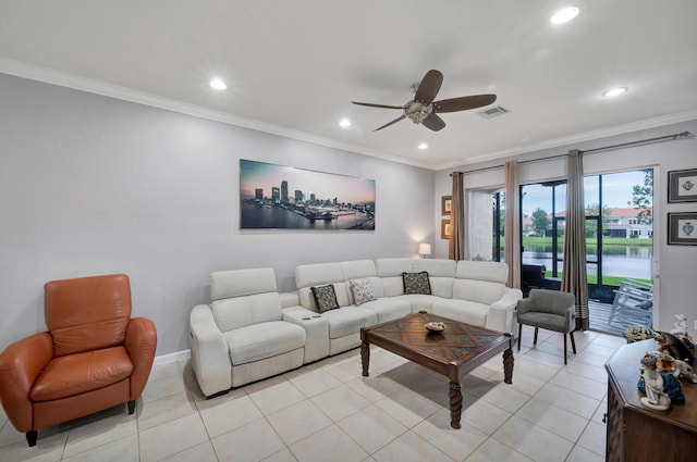 living room with ceiling fan, light tile patterned floors, a water view, and ornamental molding