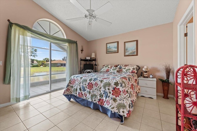 bedroom featuring a textured ceiling, lofted ceiling, access to exterior, ceiling fan, and light tile patterned floors