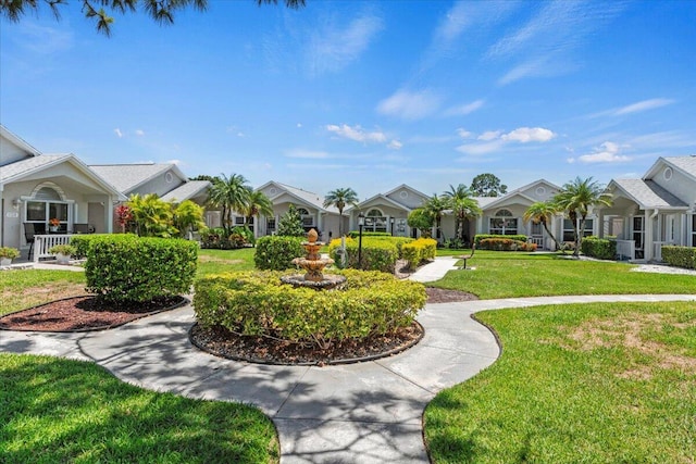 view of property's community with a yard