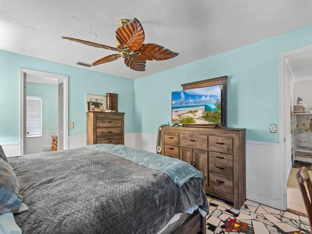 tiled bedroom with ceiling fan