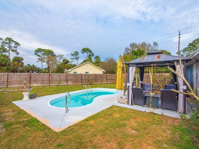 view of pool featuring a patio area, a gazebo, and a lawn