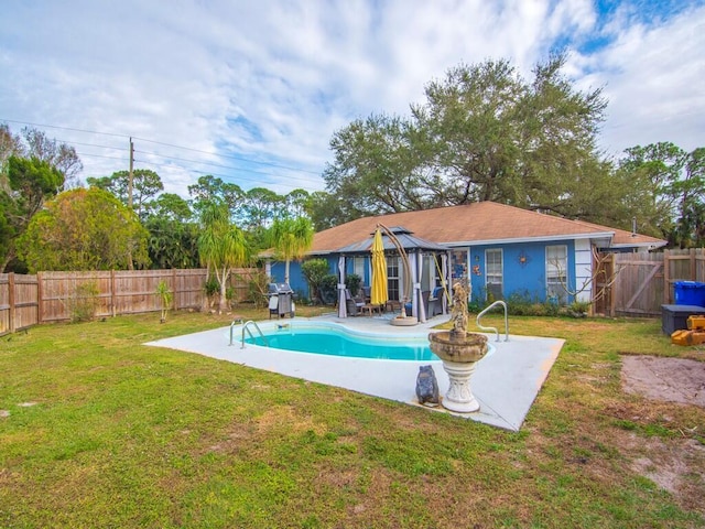 view of swimming pool featuring a gazebo, a yard, a patio, and a grill