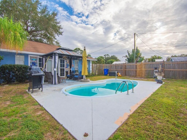 view of pool with a gazebo, a patio, a yard, and area for grilling