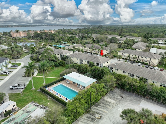 bird's eye view with a residential view and a water view