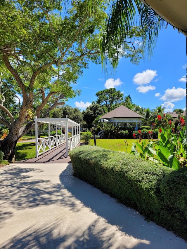 view of property's community featuring a lawn and a gazebo