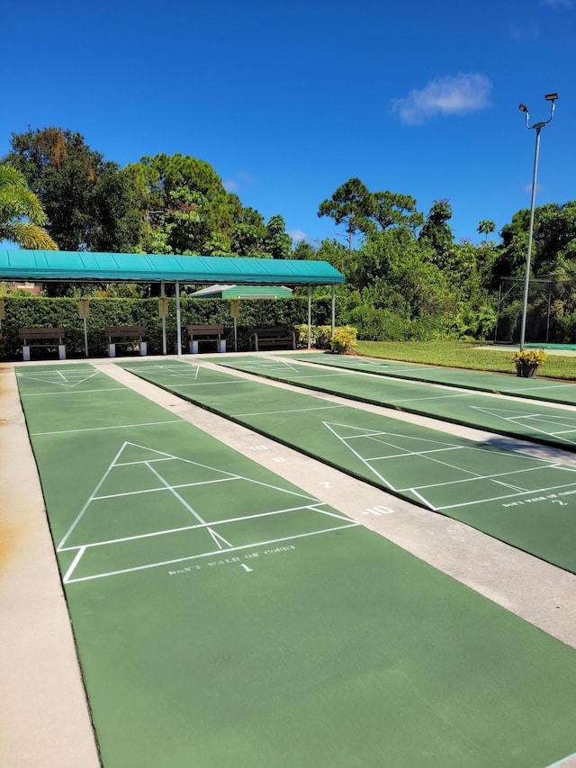 view of home's community featuring shuffleboard