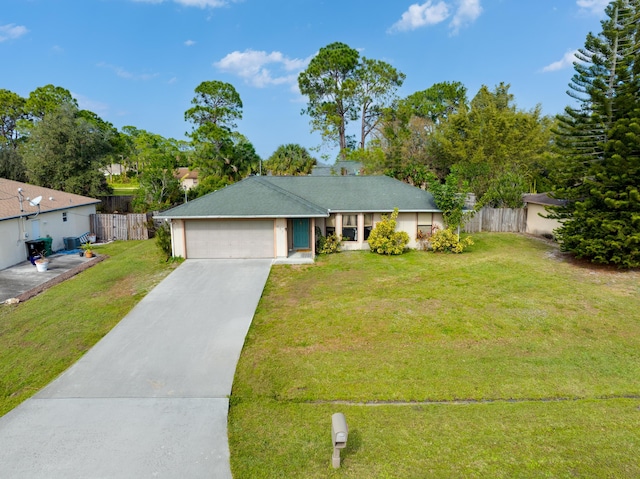 single story home featuring a front yard and a garage