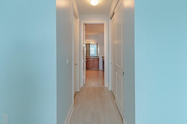 corridor featuring light wood-type flooring