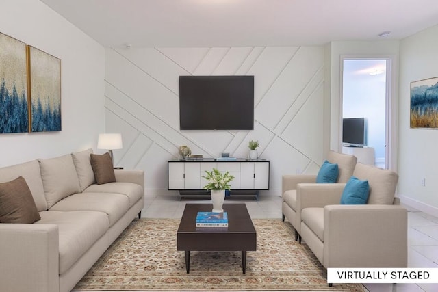 living area featuring light tile patterned floors and baseboards