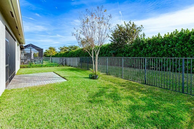 view of yard featuring a lanai and a patio