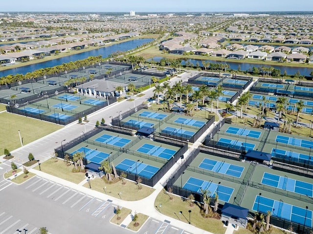 bird's eye view featuring a water view and a residential view