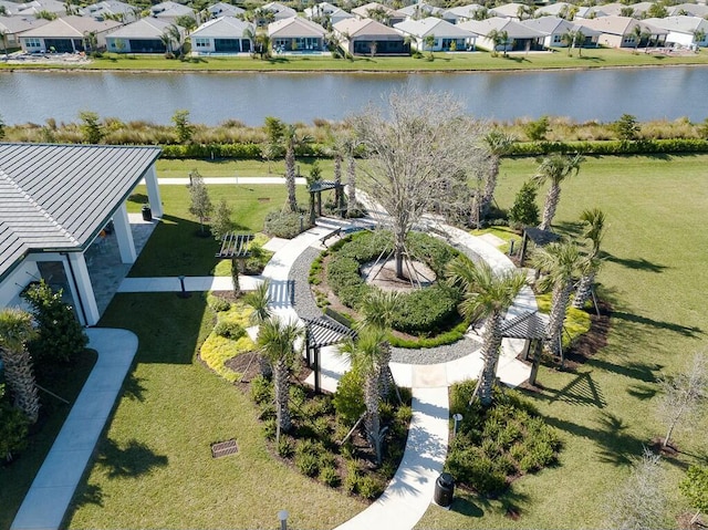 birds eye view of property featuring a water view and a residential view