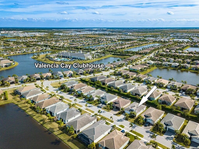 bird's eye view featuring a water view and a residential view