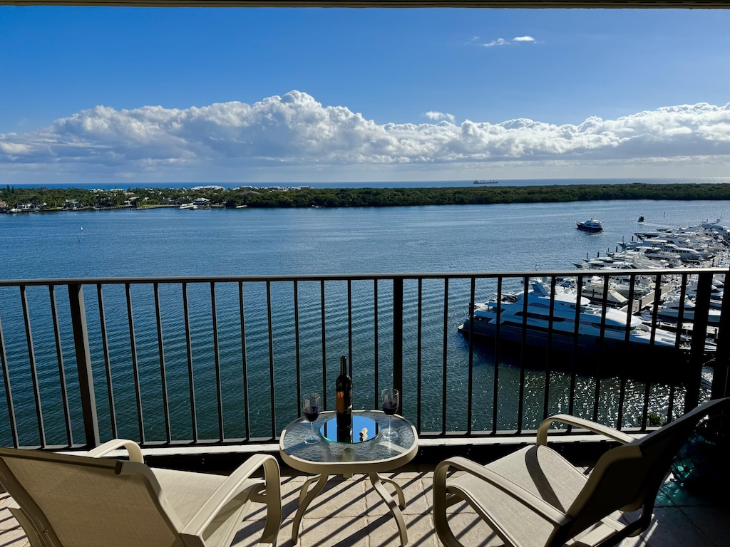 balcony featuring a water view