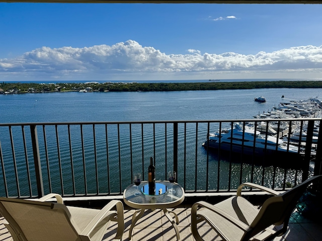 balcony featuring a water view