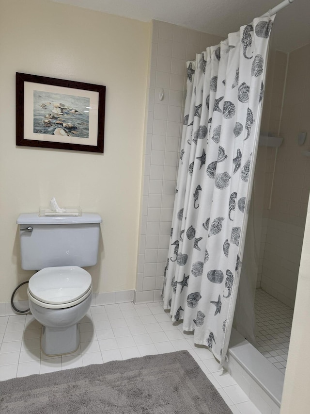 bathroom with toilet, tile patterned floors, and curtained shower