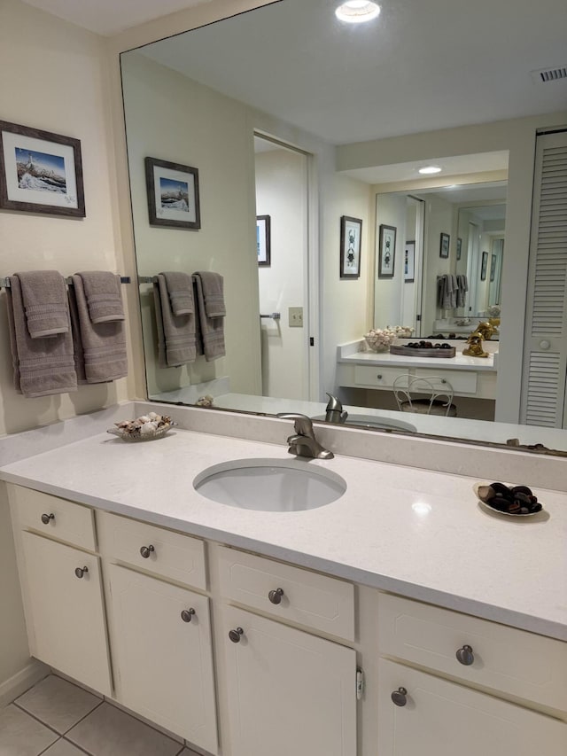 bathroom with tile patterned floors and vanity