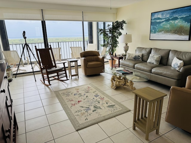 tiled living room with a water view