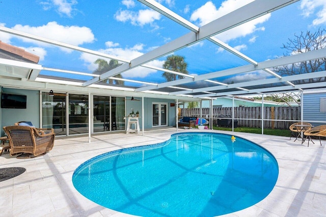 view of pool featuring a patio area and a lanai