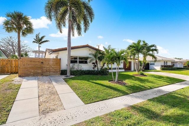 ranch-style home with a front yard