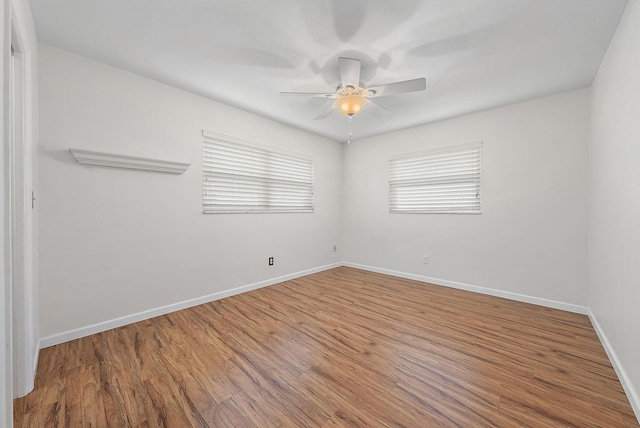 spare room featuring ceiling fan and wood-type flooring