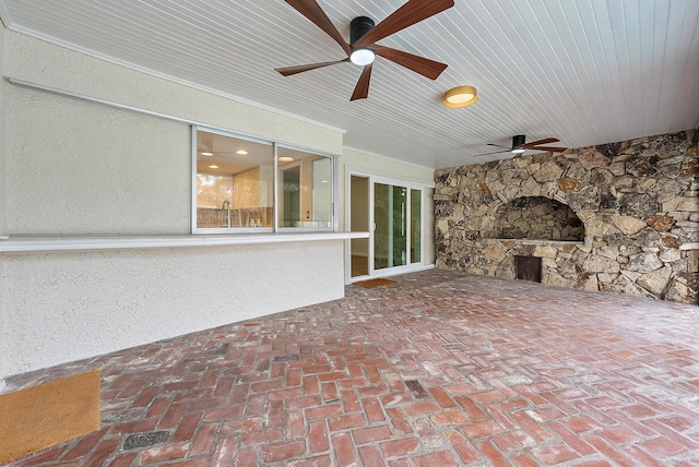 view of patio with ceiling fan and sink