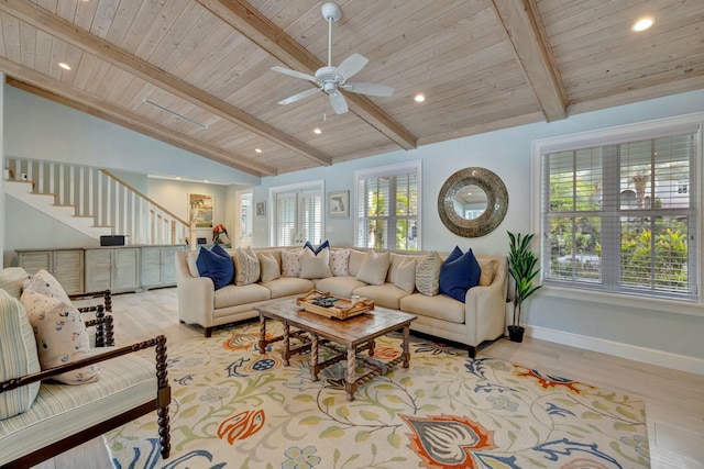 living room with ceiling fan, light wood-type flooring, wood ceiling, and vaulted ceiling with beams