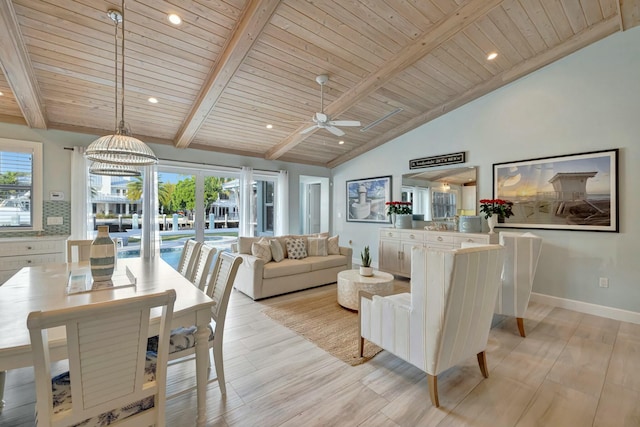 living room featuring ceiling fan with notable chandelier, wooden ceiling, light hardwood / wood-style floors, and vaulted ceiling with beams