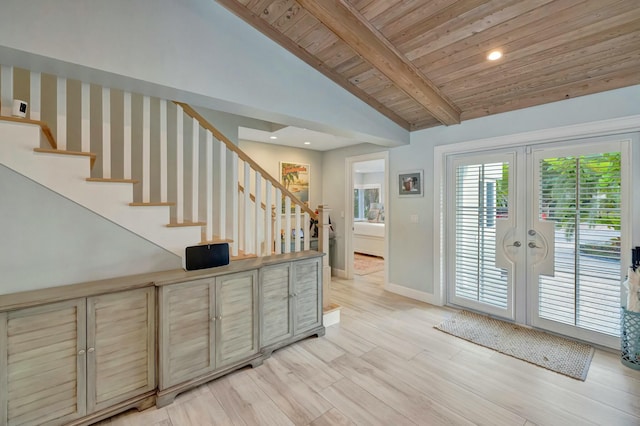 interior space featuring light hardwood / wood-style floors, wooden ceiling, lofted ceiling with beams, and french doors