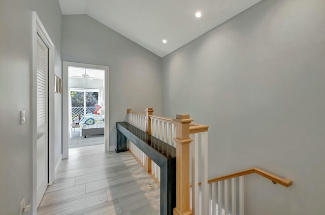 hall featuring lofted ceiling