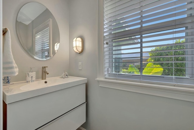 bathroom with plenty of natural light and vanity