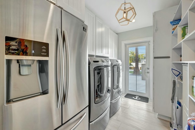 washroom featuring washer and clothes dryer