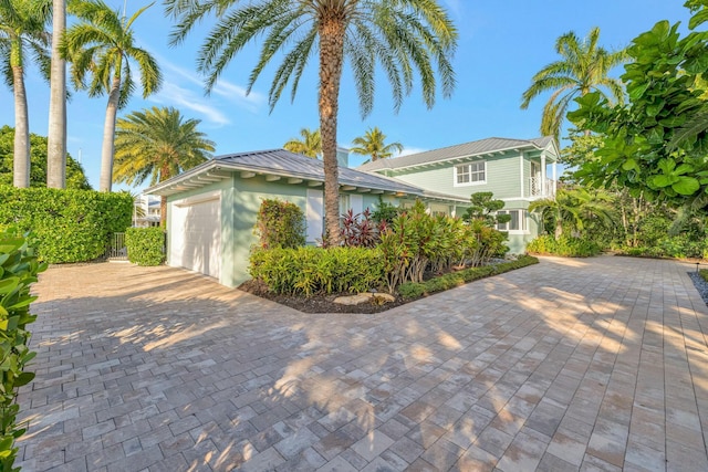 view of side of property with a garage