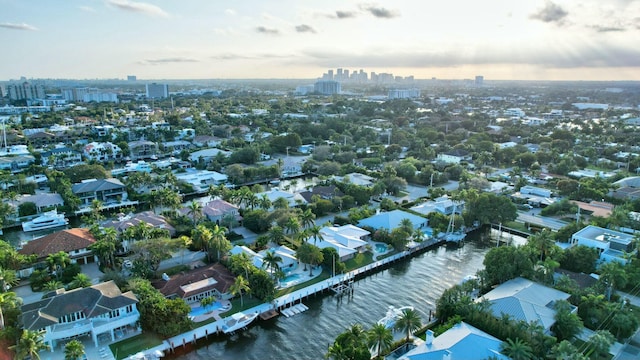 aerial view at dusk with a water view