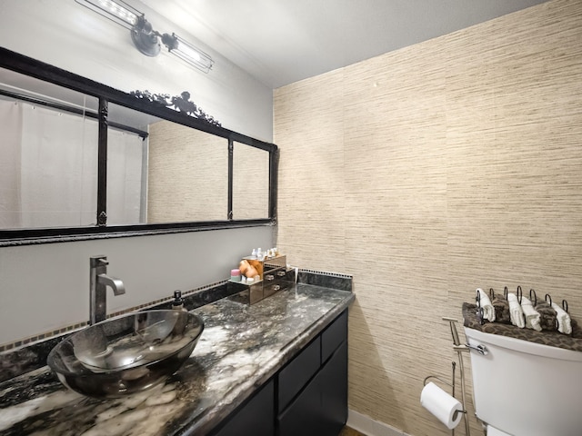 bathroom with vanity and toilet