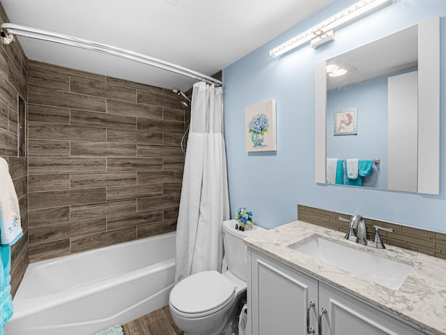 full bathroom featuring shower / bath combo, vanity, wood-type flooring, decorative backsplash, and toilet