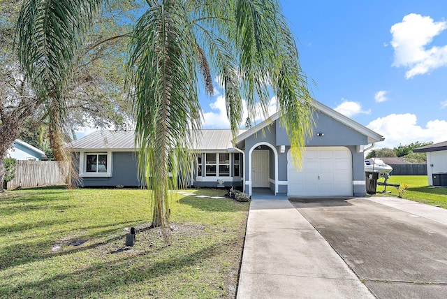 single story home with a garage, a front lawn, and central AC unit