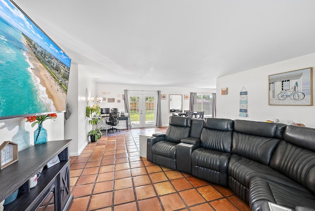 living room with tile patterned floors and french doors