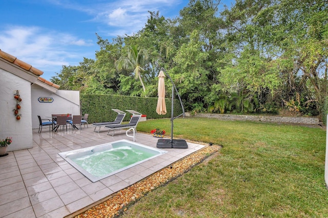 view of pool featuring a yard and a patio