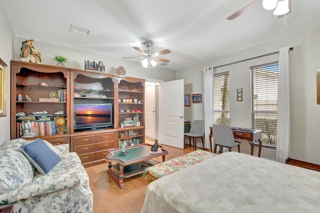 bedroom featuring ceiling fan and light hardwood / wood-style flooring