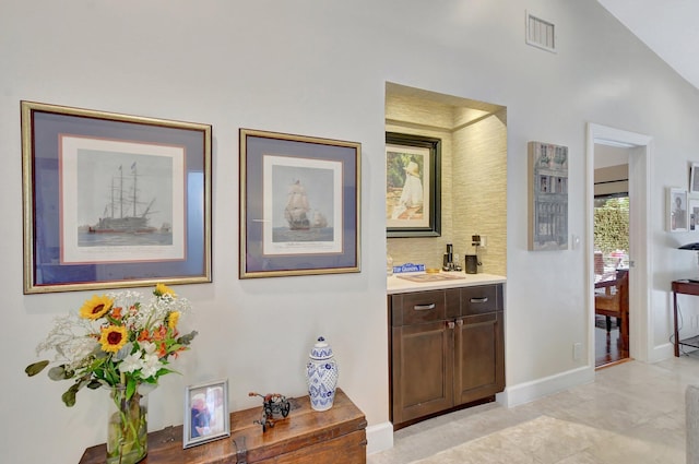 hallway with vaulted ceiling