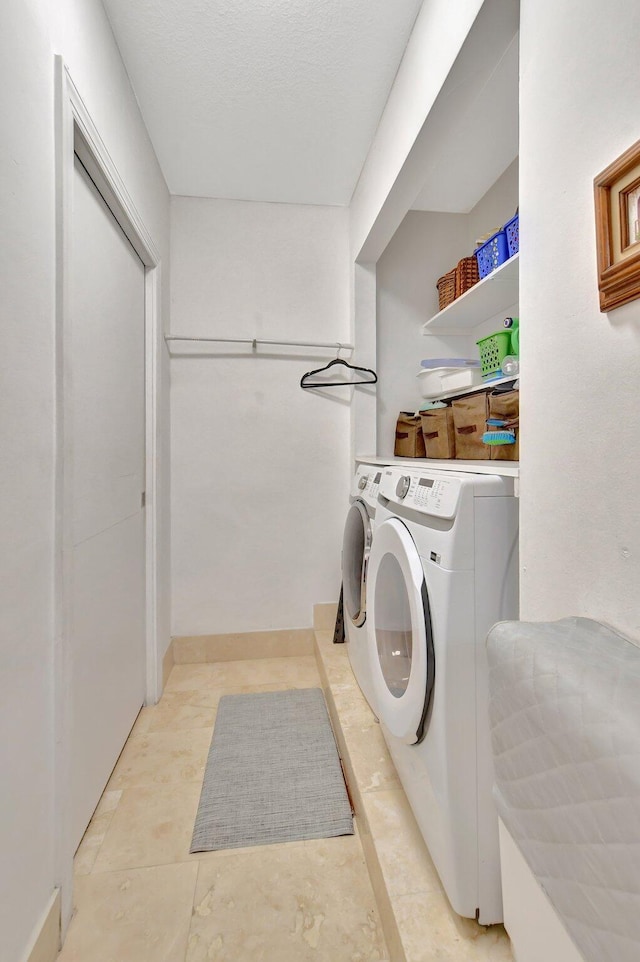 laundry area with washing machine and dryer