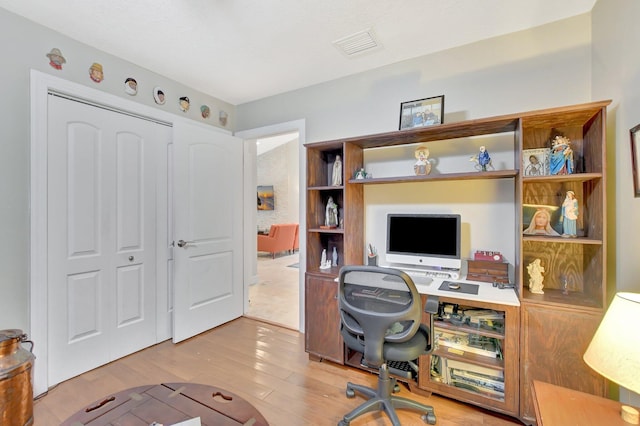 home office featuring light hardwood / wood-style flooring