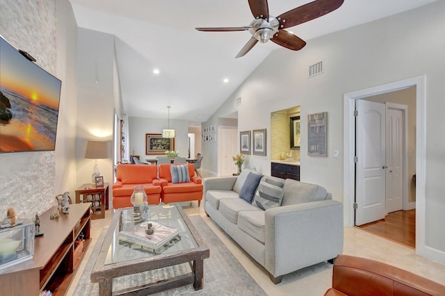 living room featuring high vaulted ceiling and ceiling fan