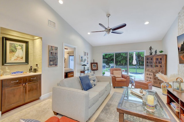 living room featuring vaulted ceiling and ceiling fan